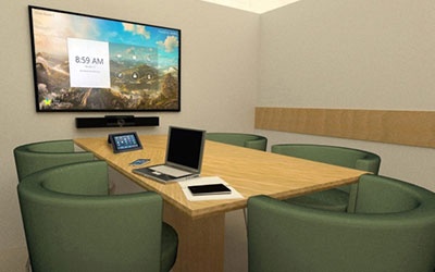 A 3D mockup of a conference room set up with AV control systems built into the table