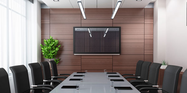 A boardroom set up with a Data Projections monitor for video conferencing