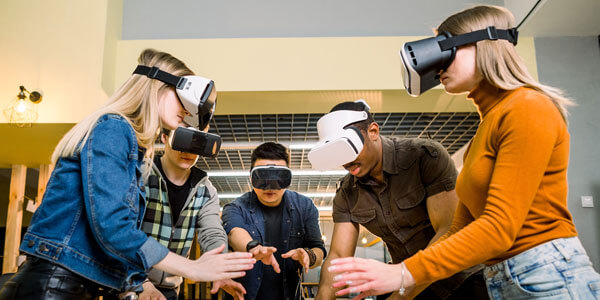 A group of people in a shared virtual reality experience using Data Projections VR headsets