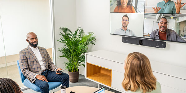 Business people using HP Poly's conferencing solutions for a video call