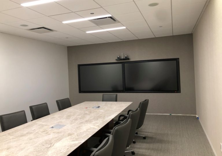 A government conference room setup with new AV systems from Data Projections for better video conferencing